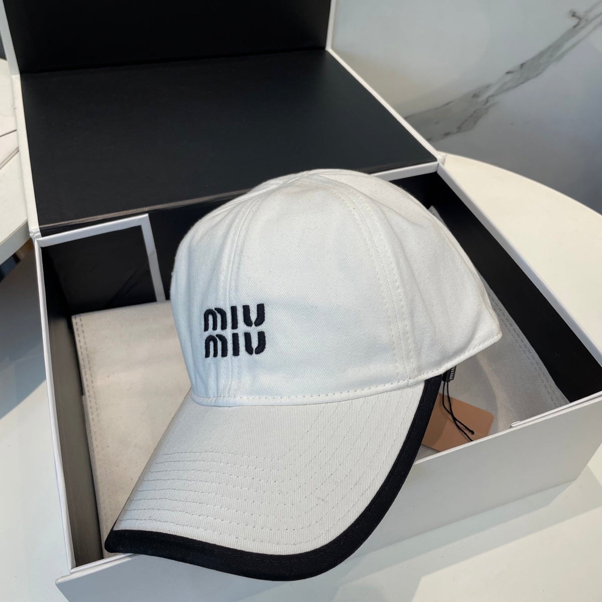 MIU MIU MM BASEBALL CAP IN WHITE AND BLACK FABRIC STYLE 1