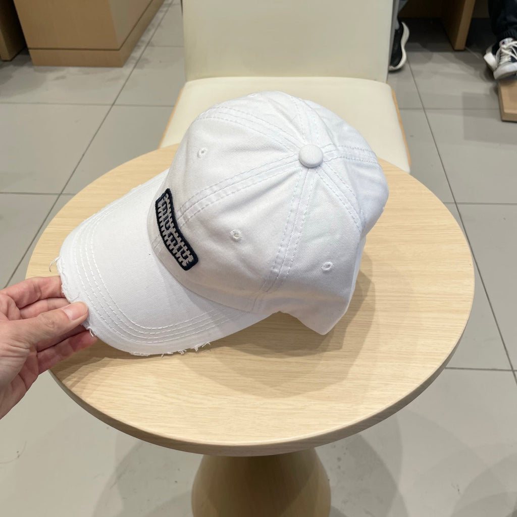 MIU MIU MM DISTRESSED FABRIC BASEBALL CAP IN WHITE WITH EMBROIDERED LOGO