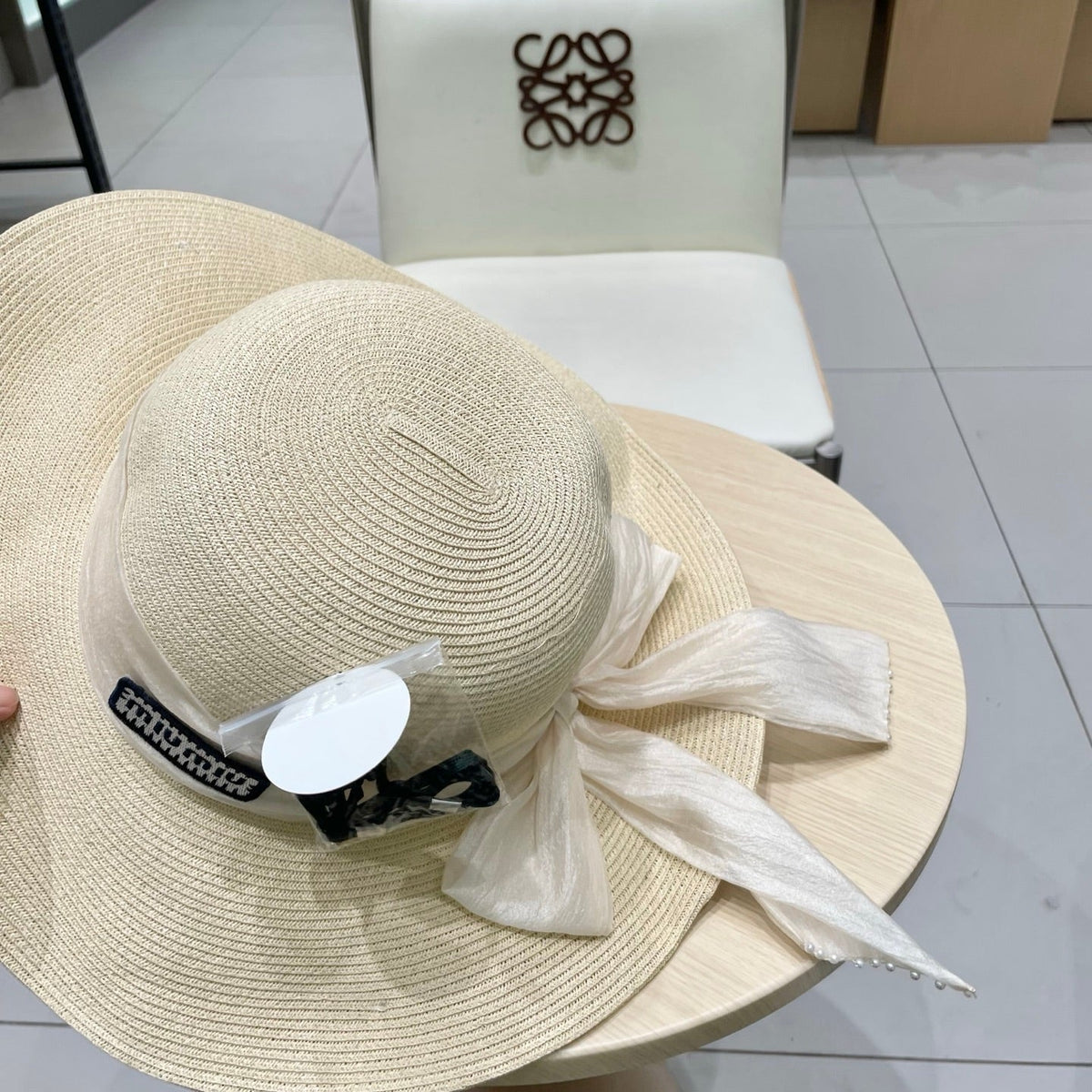 MIU MIU MM WIDE-BRIM BEACH HAT IN LIGHT BEIGE WITH FABRIC BOW